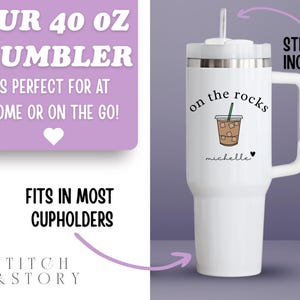 May include: White 40 oz tumbler with a handle, featuring the text "on the rocks" and a coffee illustration. Includes a straw. The tumbler has a personalized name and heart. The text "OUR 40 OZ TUMBLER" is also visible.