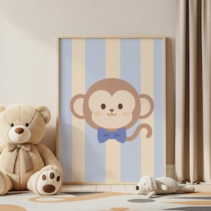 May include: A framed illustration of a cartoon monkey with a blue bow tie, set against a striped background of light blue and beige. A teddy bear and a stuffed dog are in the foreground, suggesting a nursery or children's room theme.