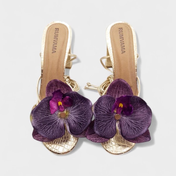 Paarse orchidee gouden hakken