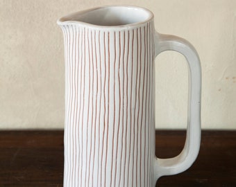 Tall white ceramics jug pitcher
