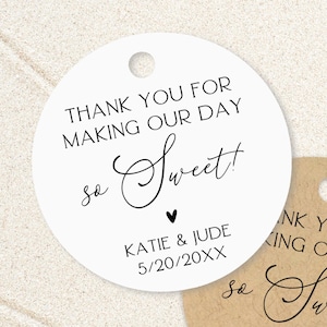 May include: Two circular gift tags, one white and one kraft brown, each featuring a hole at the top. The text reads: THANK YOU FOR MAKING OUR DAY so Sweet! with a small heart, followed by the names KATIE & JUDE and the date 5/20/20XX in black ink.