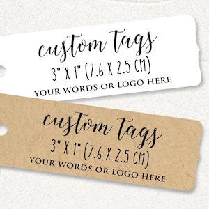 May include: Two blank gift tags, one white and one brown, with the text "custom tags 3" x 1" (7.6 x 2.5 cm) Your words or logo here" printed on them.