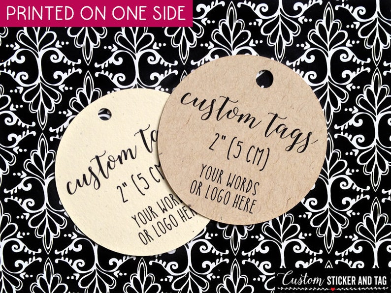 May include: Two round, brown paper gift tags with a hole punched in the top. The tags are 2 inches in diameter and have the text 'custom tags 2' (5 CM) YOUR WORDS OR LOGO HERE' printed on them.