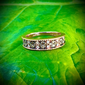 LeVian chocolate and vanilla diamonds sent in strawberry gold. Diamond band, rose gold with milgrain detail.