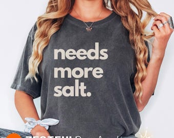 Sarcastic Foodie Tshirt Gift Idea for Him or Her Needs More Salt Cooking Chef Kitchen Bold Humor Funny Salt Quote Culinary Graphic Shirt
