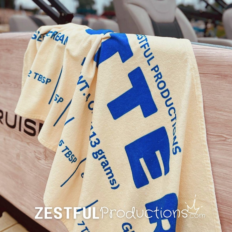 Beach Pool Essential Vintage Style Towel Quirky Butter Design Pattern Summer Vacation Accessory Cotton Backing Material Large Size Options Blue Text Detail Retro Collection Premium Quality Construction Machine Washable Nostalgic Print