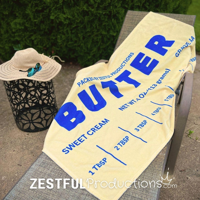 Quirky Summer Towel Vintage Style Essential Beach Pool Accessory Butter Pattern Design Blue Text Detail Cotton Backing Material Large Size Options Premium Construction Retro Collection Vacation Ready Item Nostalgic Print Pattern