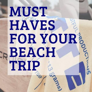 May include: A beach-themed image with the text "MUST HAVES FOR YOUR BEACH TRIP" in blue. The image includes a light-coloured towel with blue graphics and text, and the Etsy shop URL. The image also includes the text "Butter Themed Accessories and Gifts for the Whole Family!"