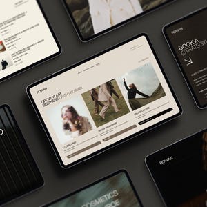 May include: Multiple tablet screens displaying a website interface with the text ROWAN, GROW YOUR BUSINESS (WITH) ROWAN, 1:1 COACHING, GROUP WORKSHOP, and ONLINE COURSE. The screens feature various layouts with beige and dark backgrounds, photography, and navigation menus.