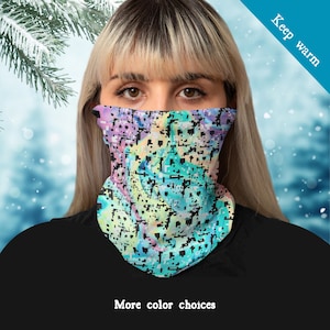 May include: A neck gaiter with a pixelated pattern in pastel shades of purple, blue, green, and yellow. The text "Keep warm" is displayed diagonally on the upper right. The text "More color choices" is displayed at the bottom.