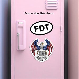 May include: A pink locker door with a white eagle holding a circle with a QR code. The eagle is surrounded by an American flag. The text "More like this item" and "FDT" are on the locker door.