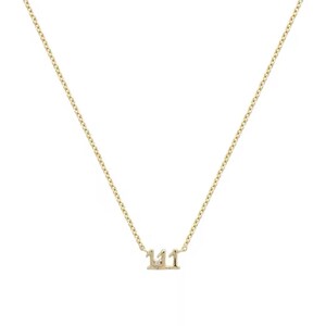 May include: A gold chain necklace with a pendant featuring the number 111 with a small diamond in the center.