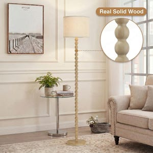 May include: A floor lamp with a tall, slender stand composed of stacked light-colored wooden spheres. The lamp features a cylindrical off-white fabric shade. A circular inset highlights the texture of the real solid wood construction.