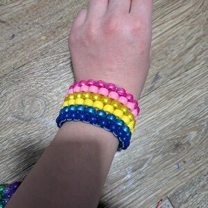 Pink, yellow and blue Kandi cuff