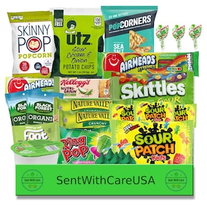 May include: A green and yellow care package with a variety of snacks, including popcorn, potato chips, granola bars, gummy candies, lollipops, and sour candies. The package includes brands like Skinny Pop, Utz, Kellogg's, Nature Valley, Airheads, Skittles, and Sour Patch Kids.