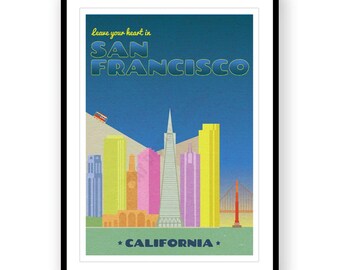 May include: A framed San Francisco travel poster with a black border. The poster features a stylized cityscape with the text "Leave your heart in San Francisco" and "California". The image includes a cable car, the Golden Gate Bridge, and iconic buildings.