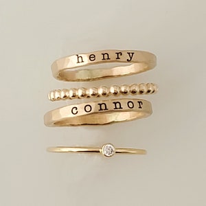 Gold stackable rings

Stacking Name Rings | Stackable Rings | Personalized Name Rings | Mother's Day Gift for Mom | Mom Rings | Children Names | Gold filled