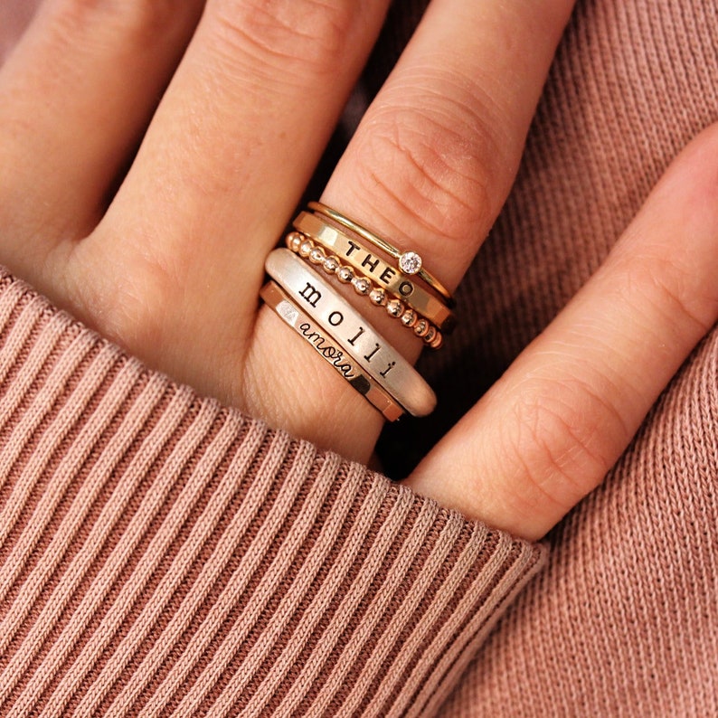 Up close look at a ring set on a models hand.
Stacked Name Rings | Stackable Rings | Design Ring Set|Personalized Mom Gift | Stacking Custom Rings | Easter Gift for Her