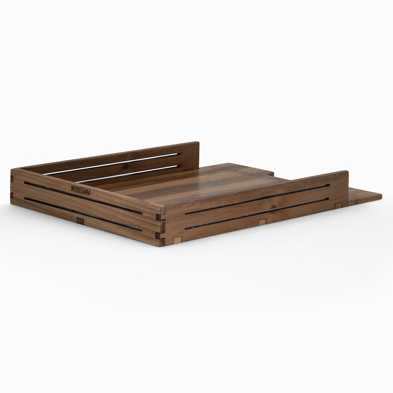 May include: A wooden document tray with a raised lip and a label that reads "WOODISAKA".