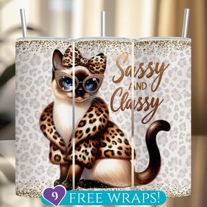 May include: A tumbler featuring a cartoon cat wearing a leopard print bow, glasses, and coat. The words "Sassy and Classy" are written in gold script. The background has a leopard print pattern.
