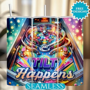 May include: A tumbler with a vibrant pinball machine design. The artwork features a colorful, detailed illustration of a pinball machine with the words "TILT Happens" in a glittery font. The tumbler includes a straw and the words "FREE DESIGNS" and "SEAMLESS".