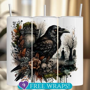 May include: White tumbler featuring a detailed illustration of a black raven perched on skulls and surrounded by foliage, a tombstone, and a graveyard scene. The text "9 FREE WRAPS!" is at the bottom. Includes a silver straw.