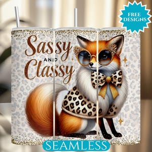 May include: A white tumbler with a gold glitter background and a fox wearing a leopard print sweater and a gold bow. The text "Sassy and Classy" is written in gold glitter letters.