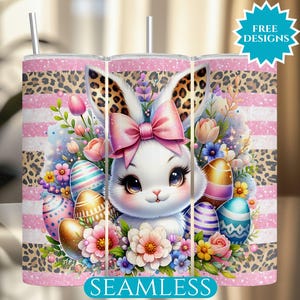 May include: A pink and white tumbler featuring a charming cartoon bunny rabbit wearing a pink bow and surrounded by colourful Easter eggs and flowers. The tumbler has a leopard print design and the words "Seamless" at the bottom.