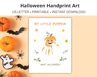 May include: A Halloween art print with a handprint pumpkin design, the text reads "My Little Pumpkin" and "Happy Halloween." The image includes orange pumpkins, black bats, spiders, and a ghost-shaped cookie on a light orange background.