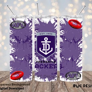 May include: A set of three stainless steel tumblers with lids and straws. The tumblers feature a purple and white design with the Fremantle Dockers logo, AFL logos, and a red football. The text "EST. 1994" is also visible.