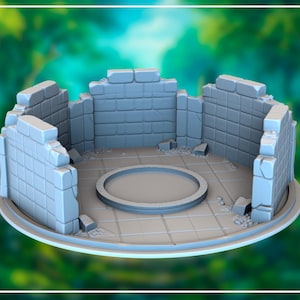 May include: A light gray miniature model of a ruined circular structure, likely for tabletop gaming. The walls are broken and made of stone blocks. A circular platform is in the center. The model sits on a circular base.
