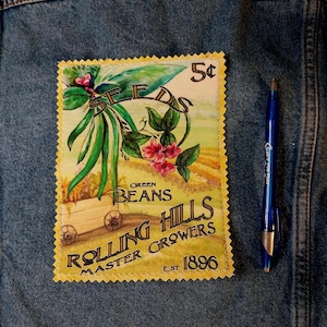 May include: A vintage-style patch featuring a colorful illustration of green beans and flowers, with the text "SEEDS" and "GREEN BEANS". The patch also includes the text "ROLLING HILLS MASTER GROWERS EST. 1896" and a price of "5¢".