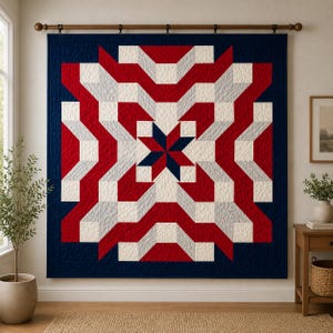 May include: A large, geometric quilt with a patriotic theme. The quilt features a central star design in navy blue, surrounded by red, white, and gray geometric shapes. The quilt is displayed on a wall, adding a decorative touch to the room.