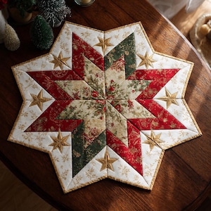 May include: A star-shaped quilted table mat featuring a patchwork design in red, green, and cream fabrics with gold metallic accents. The center displays a floral pattern, surrounded by geometric star points with embroidered gold star motifs.