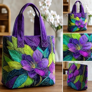 May include: A quilted tote bag with a floral design. The bag features a large purple flower with green and blue leaves. The handles and trim are a solid purple color. The bag is made of fabric and has a structured shape.