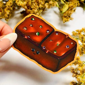 Kosmischer Brownie-Aufkleber für Laptops, Zeitschriften und mehr / Wasserfester Retro-Snack-Aufkleber / 2000s Snack-Aufkleber / Süßer Kawaii-Dessert-Lebensmittelaufkleber