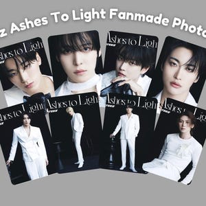 May include: Fanmade photocards featuring members of Ateez. Each card displays a different member in a white suit, with the text "Ashes to Light" on each card. The background is a dark gray.