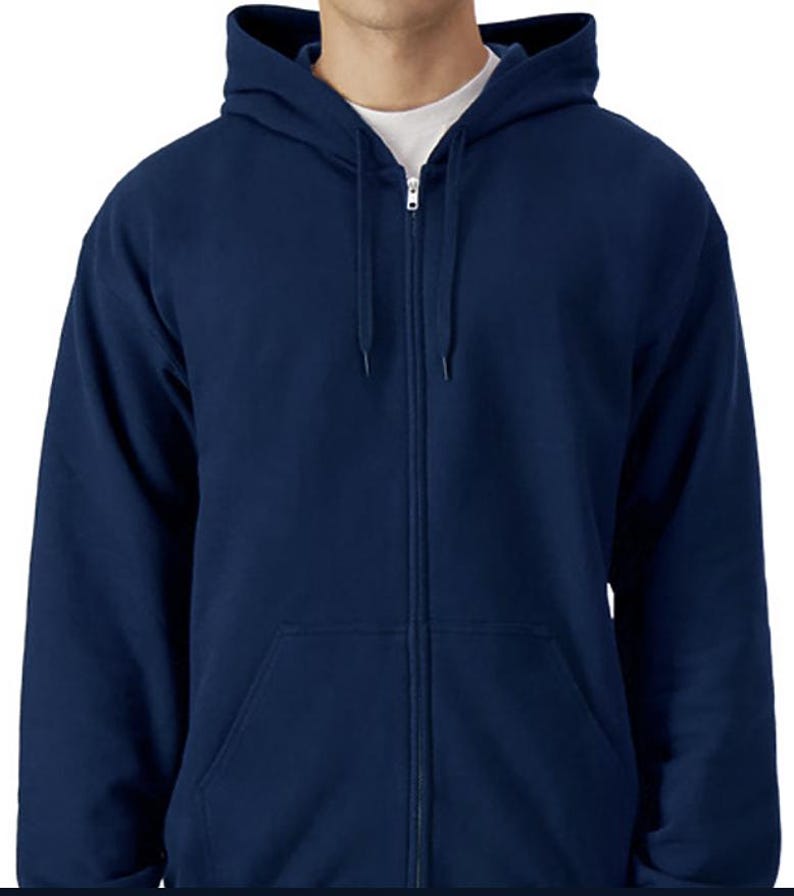 A man wearing a navy blue hooded sweatshirt with a zipper and drawstring hood.
