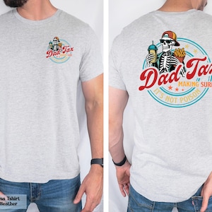 a man wearing a t - shirt that says dad tax