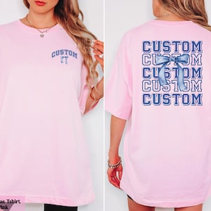 a woman wearing a pink tshirt with custom lettering