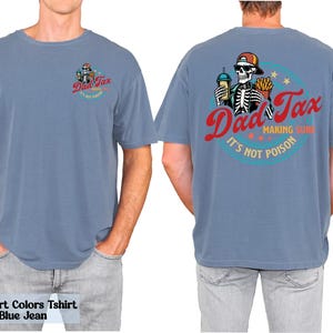 a man wearing a blue shirt with a skeleton on it