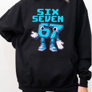A woman wearing a black hoodie with a graphic design featuring a blue character and the text "Six Seven" printed on it.