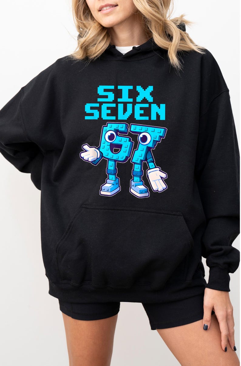 A woman wearing a black hoodie with a graphic design featuring a blue character and the text "Six Seven" printed on it.