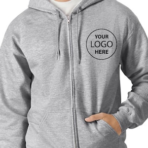A gray zip-up hoodie with a logo on the front pocket.