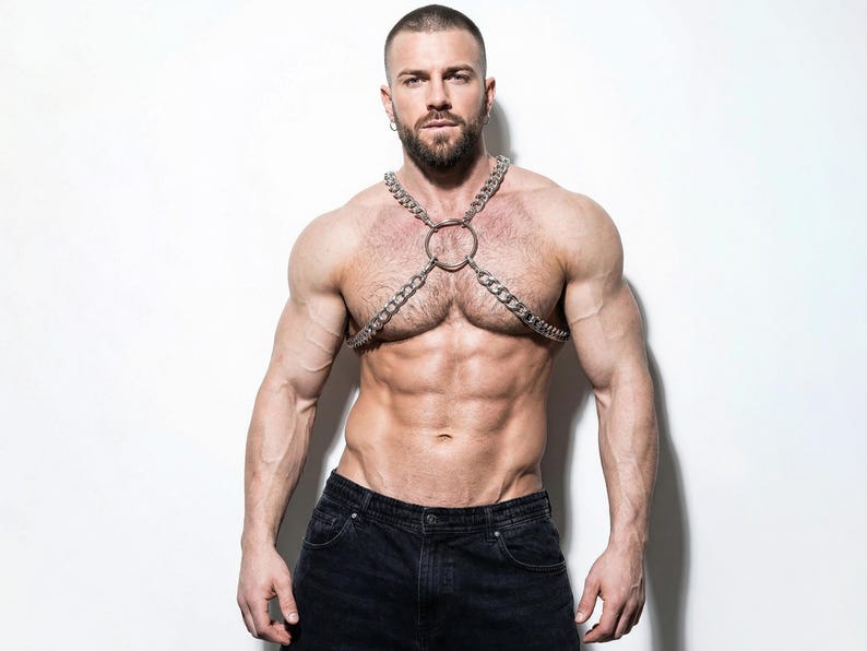 Men's silver chain chest harness, front view, muscular model, lightweight aluminum O-ring body jewelry, gay pride festival accessory