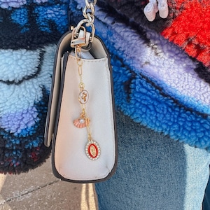 pink and red Catholic bag charm