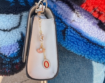 pink and red Catholic bag charm