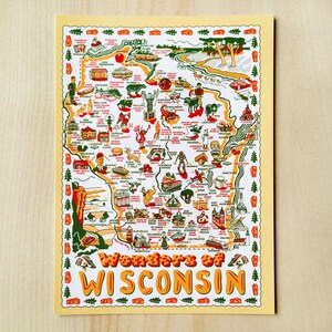 May include: A colorful map of Wisconsin with illustrations of landmarks and attractions. The map features the text "Wonders of Wisconsin" in orange and yellow, with a yellow border and a light yellow background.
