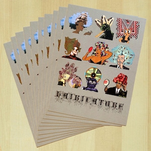 May include: A stack of tan-colored art prints featuring colorful illustrations of people with elaborate hairstyles. The prints have a vintage aesthetic, with the word "HAIRITECTURE" printed in a decorative font at the bottom of the images.