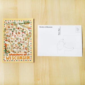 May include: A postcard featuring a colorful map of Wisconsin with illustrations of landmarks and attractions. The text "Wonders of Wisconsin" is displayed. The back of the postcard has a drawing of a bear holding a sign.